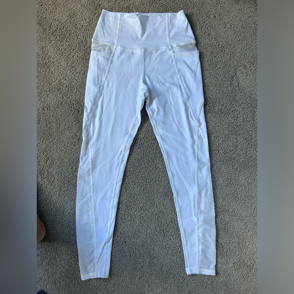Jala clothing- white legging with mesh cut outs on hips and legs. Size small